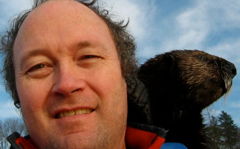 Dumas on a shoulder, showing warm fur even when wet