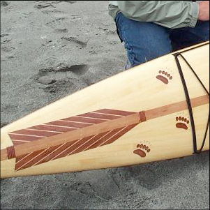 Child's cedar kayak with bear paw inlays