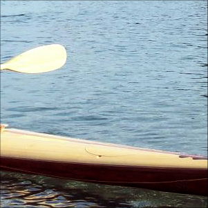 Child paddling a small kayak
