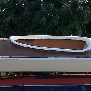 Stitch-and-glue panel kayak on a car roof